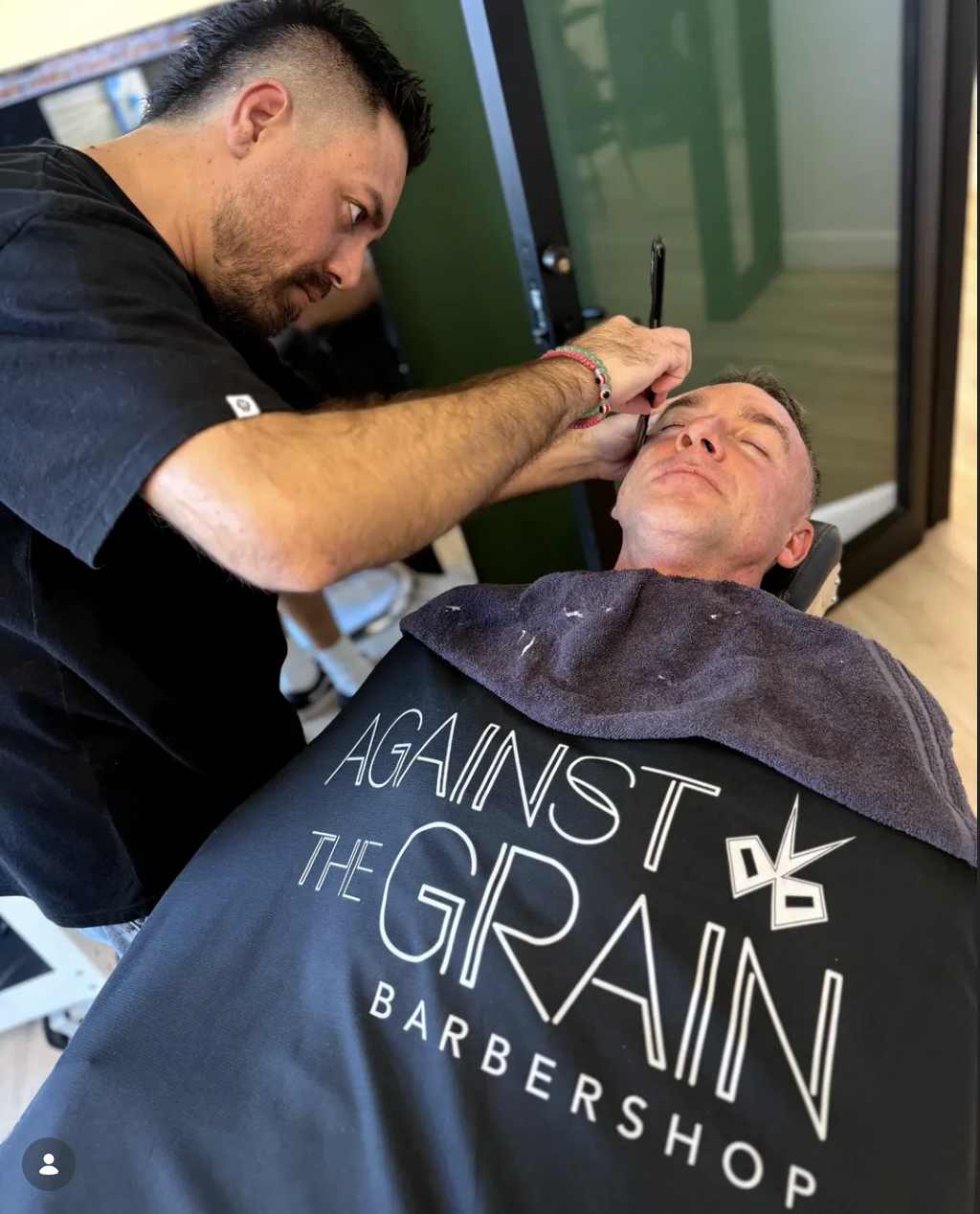Joe giving a straight-razor shave in the Against The Grain chair