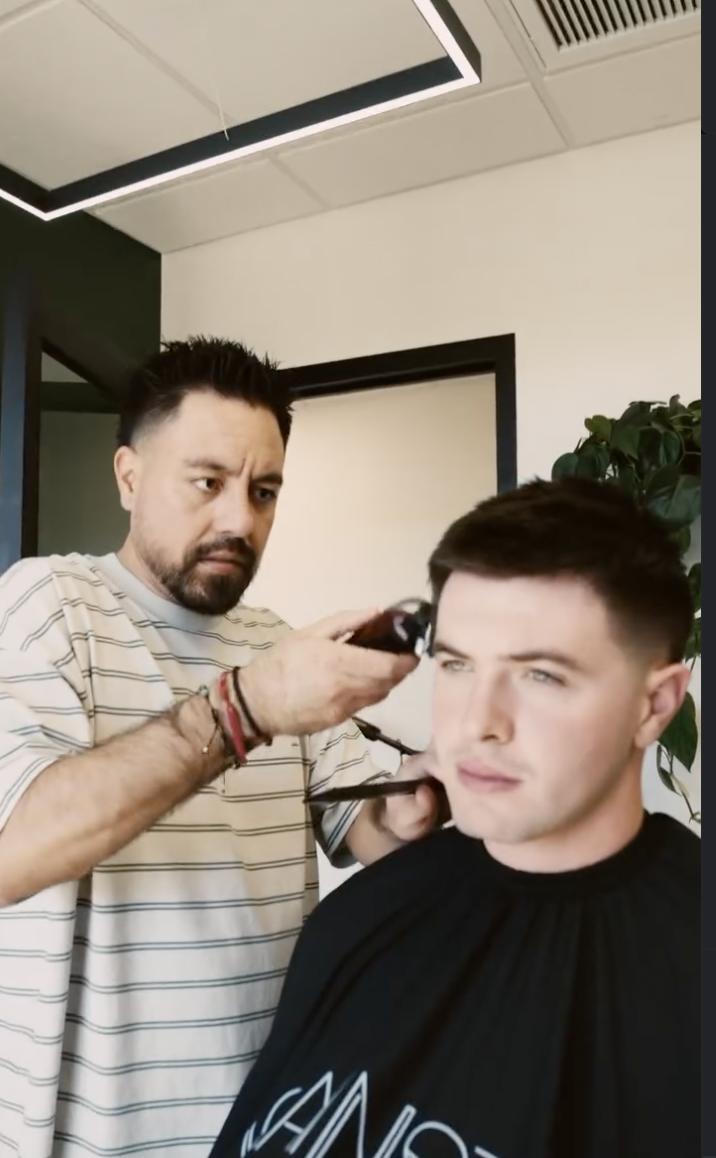 Joe concentrating on a client's haircut